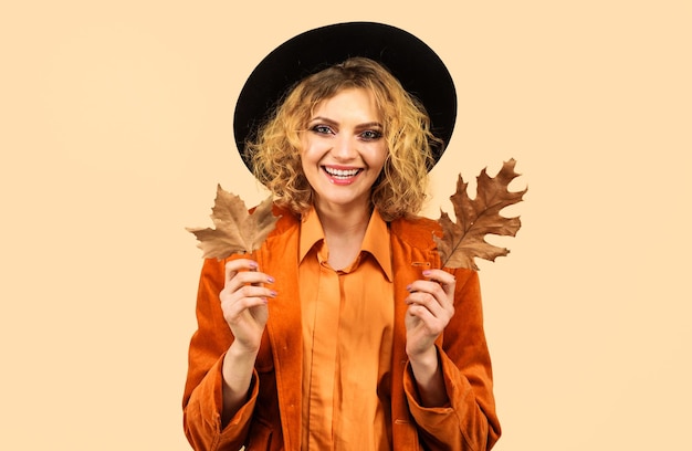 Autumn fashion model smiling girl with yellow leaves woman in black hat season sale discount