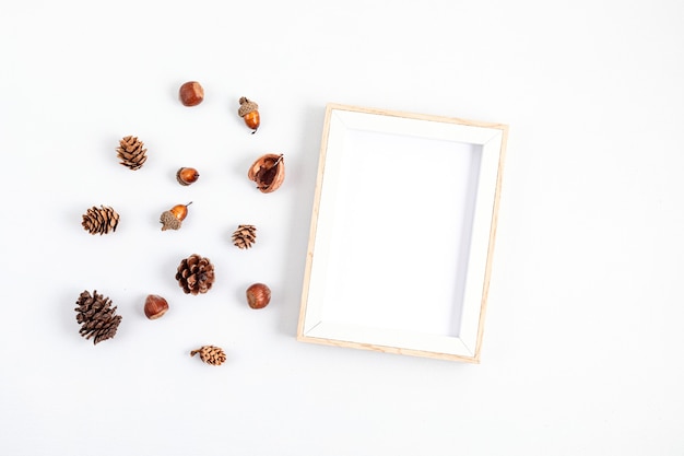 Autumn flat lay composition with pine cones and nuts isolated