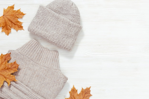 Autumn flat lay with warm clothing. Fashion clothes for womans