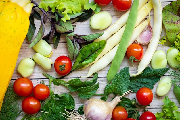 Autumn fresh vegetables on wooden table background