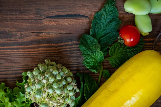 Autumn fresh vegetables on wooden table background