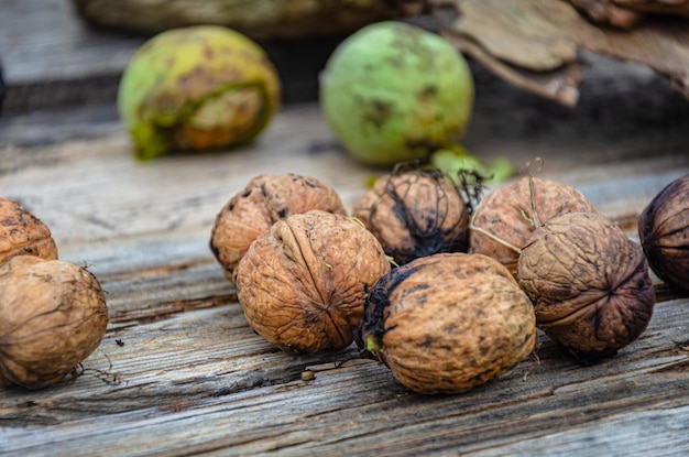 Autumn harvest of nuts in the garden on an old board.