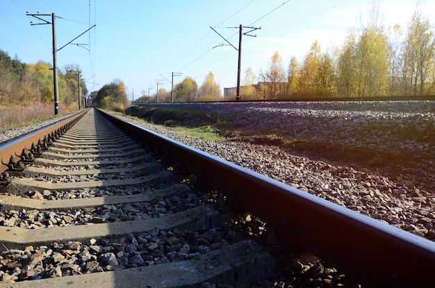 Autumn industrial landscape. Railway receding into the distance 