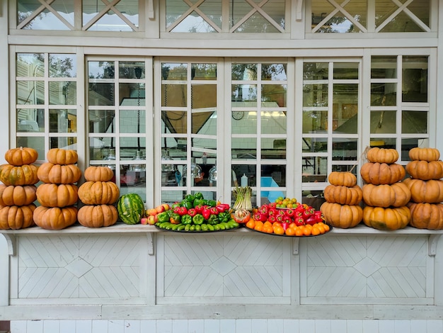 Autumn installations hay flowers and pumpkins