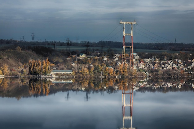 autumn landscape with mirroring in river water