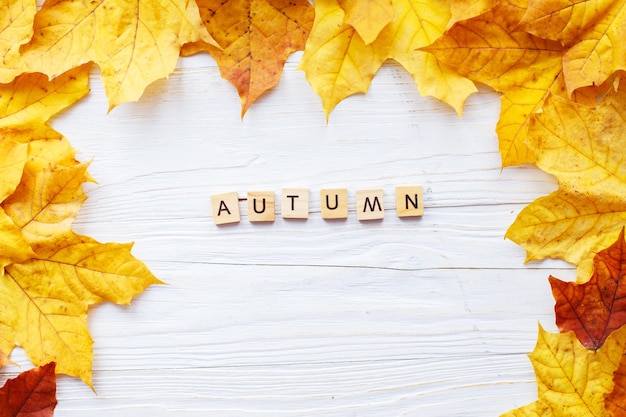 Autumn Leaves over wooden background Autumn leaves frame