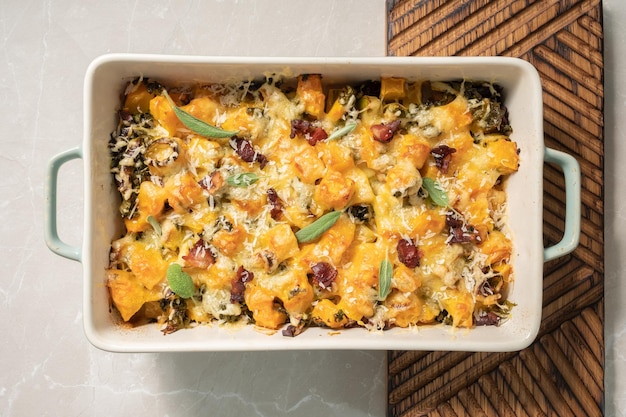 Autumn pumpkin casserole with leek bacon and kale