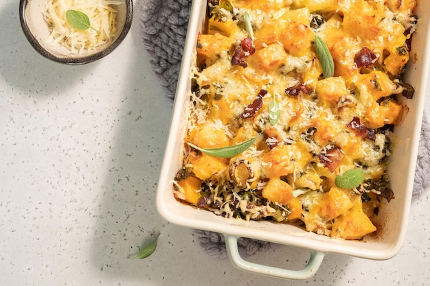 Autumn pumpkin casserole with leek bacon and kale