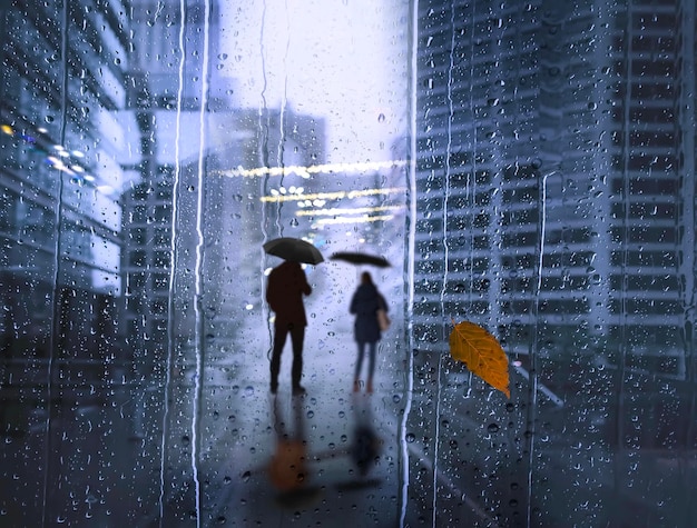 Autumn  Rainy drops on window , couple man and woman  with umbrella silhouette