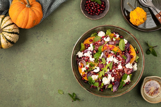 Autumn salad of baked pumpkin chorizo and mozzarella The concept of healthy eating The concept of autumn nutrition