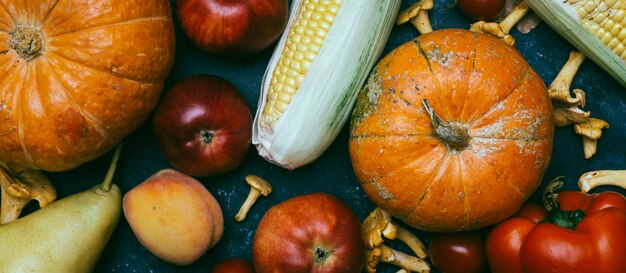 Autumn seasonal vegetables and fruit: pumpkin, pear, apples, corn, chanterelles