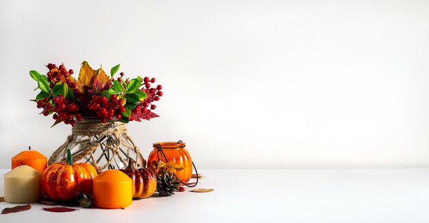 Autumn Still Life Leaves candles pumpkins and more on a light background The concept of autumn coziness and warmth Design with room for text