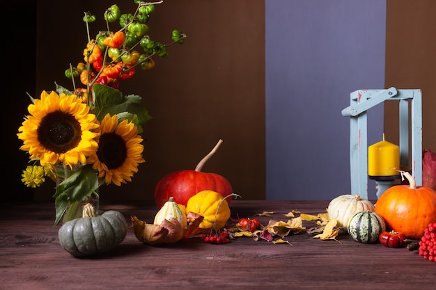 Autumn still life with pumpkins and candles