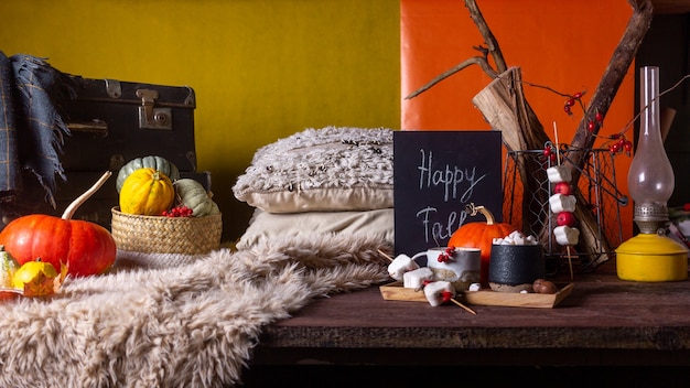 Autumn still life with pumpkins and plaids