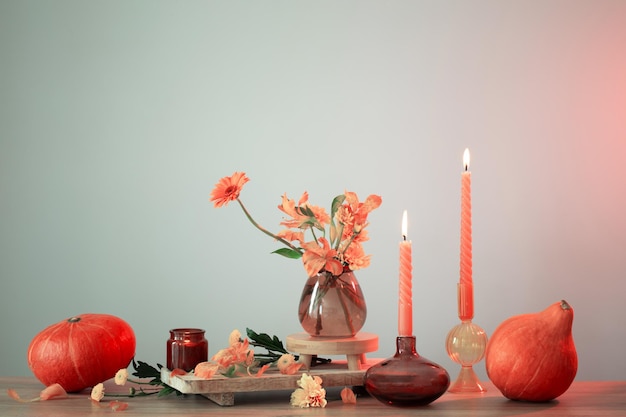 Autumn still life on wooden shelf on background wall