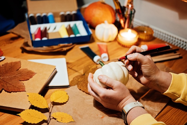 Autumn thanksgiving pumpkins craft diy fall crafts for adults female hands draw patterns on white