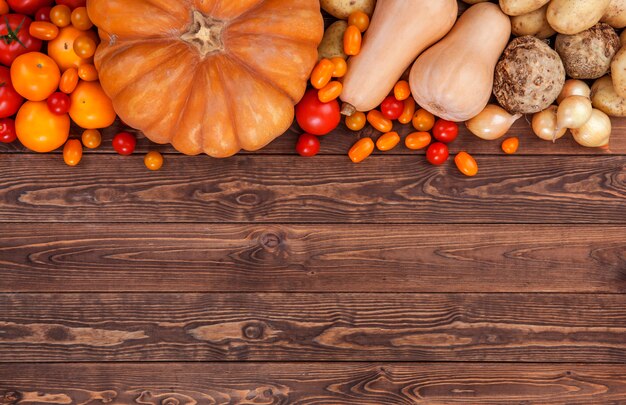 Autumn vegetables background, top view