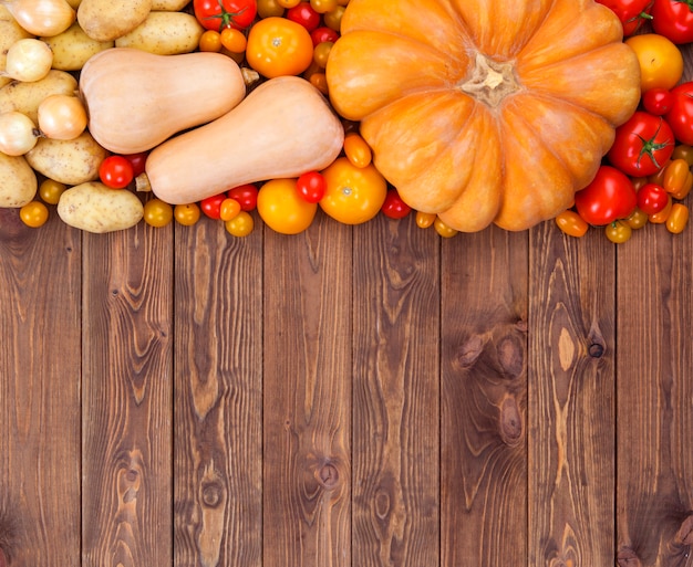 Autumn vegetables harvest on wooden surface 