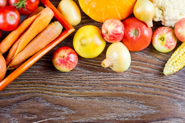 Autumn vegetables Thanksgiving harvest, raw healthy organic food on wooden background