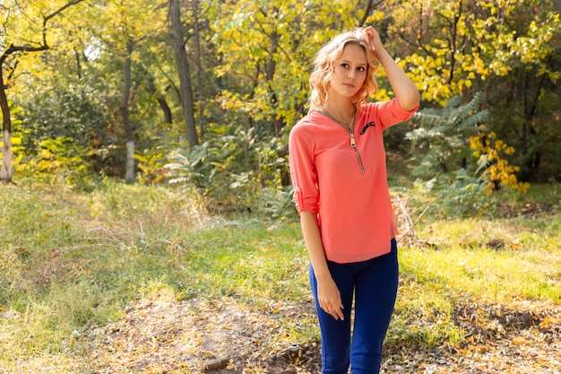 Autumn woman portrait outdoors at the park