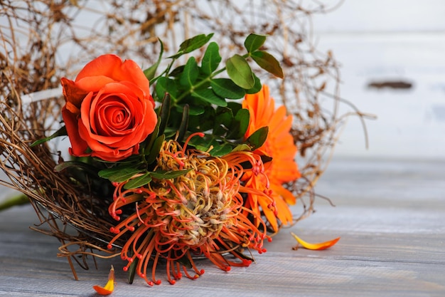 Autumnal orange bouquet with rosa and gerbera