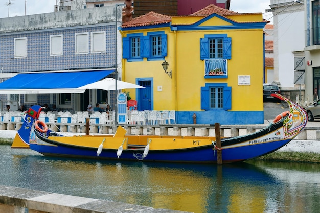 Aveiro Portugal May 16 2022 traditional Moliceiro gondola boat docked on the river channel downtown