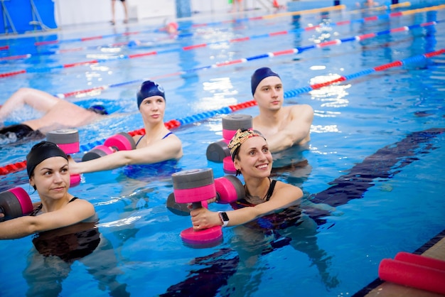 Avka aerobics in the swimming pool A group of young people in training