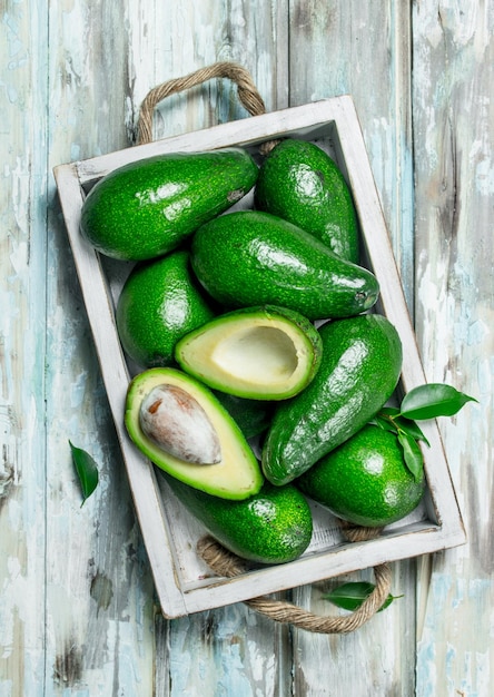 Avocado and avocado slices in white dressing