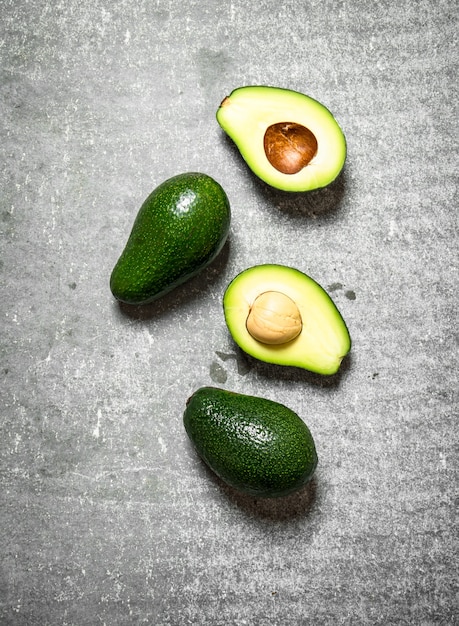 Avocado green on the stone table .Top view