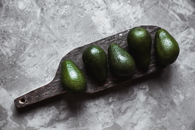 Avocado. Healthy food on the table. Rustic board.