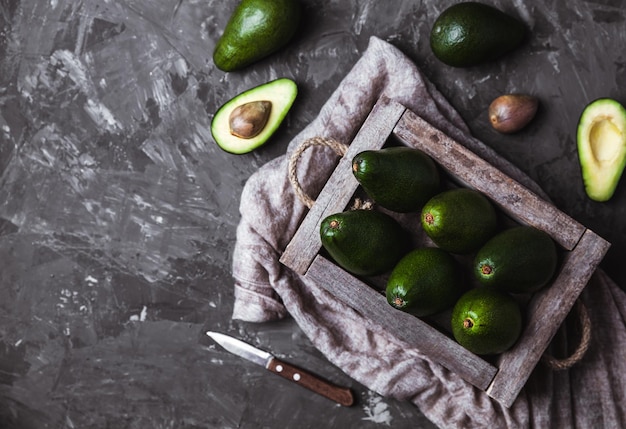 Avocado. Healthy food on the table. Vintage wooden box