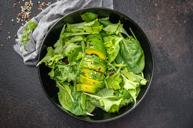 avocado salad fresh leaf mix lettuce spinach arugula chard meal snack on the table copy space