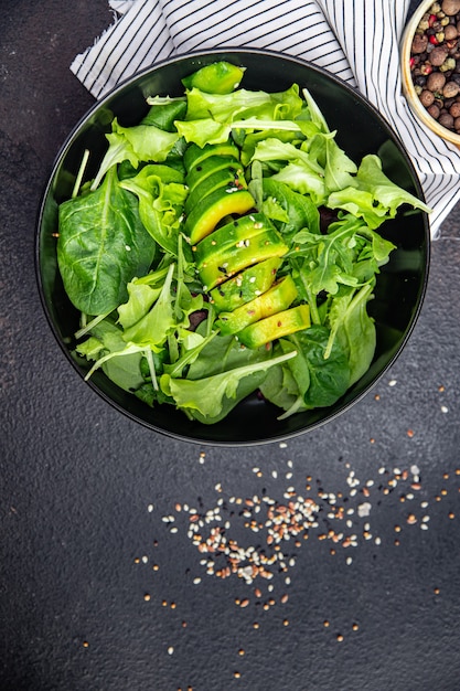 Avocado salad lettuce leaf mix spinach arugula chard lettuce fresh meal snack on the table