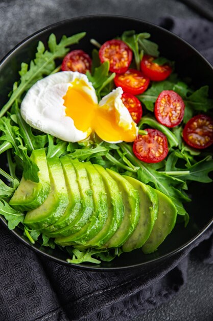 avocado salad poached egg arugula tomato green salad leaves meal food snack on the table