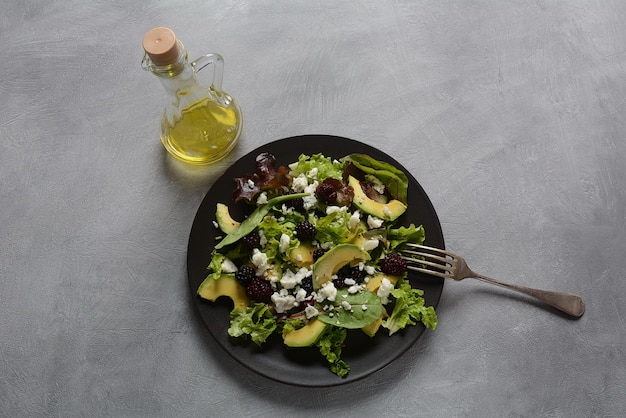 Avocado salad with lettuce and olive oil