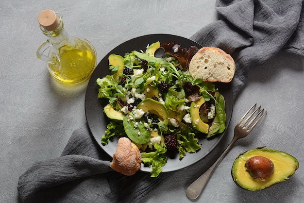 Avocado salad with lettuce and olive oil