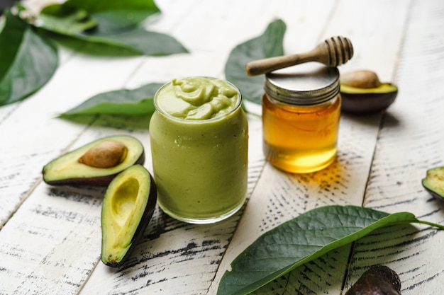 Avocado spinach and green smoothie healthy food white background