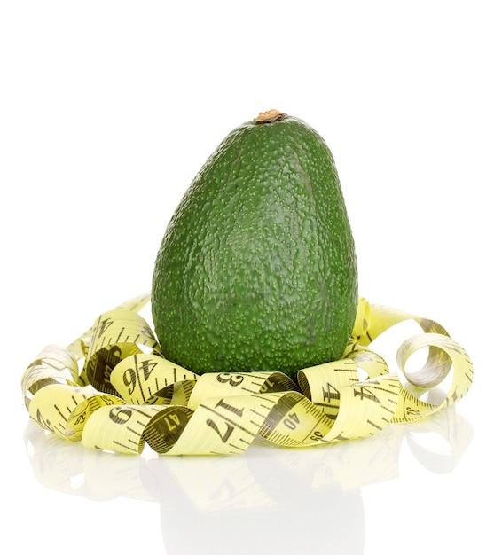 Avocado with measuring tape isolated on white