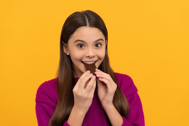 Award yourself with one bite Happy girl eat chocolate Chocolate eating Enjoying sweet snack