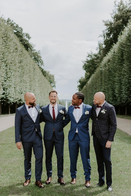 Awesome groom and groomsmen getting crazy in the forest and performing tricks on a wedding day.