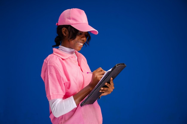 Awesome lady isolated over blue background taking records