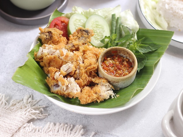 Ayam Geprek Indonesian Food crispy fried chicken with hot and spicy sambal Chili Sauce