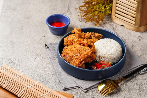 Ayam Geprek is an Indonesian Food crispy fried chicken with hot and spicy sambal Chili Sauce