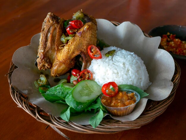 Ayam Goreng Geprek Ayam Gongso fried chicken with red hot chilli traditional food from Indonesia