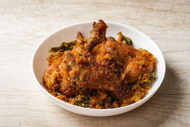 Ayam Goreng Padang. Traditional fried chicken with spice crumbs from Minangkabau, West Sumatra.