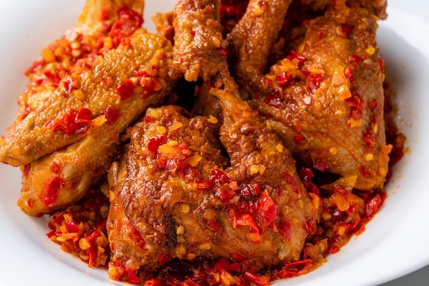 Ayam sambal balado or spicy fried chicken is Traditional food from Padang West Sumatra