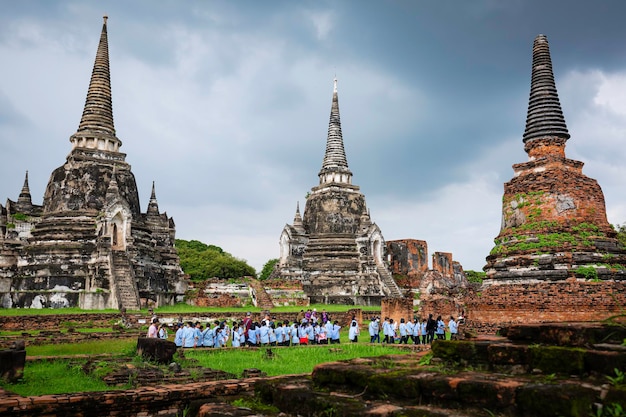 Ayutthaya Thailand October 5 2022 Student touring pagoda Wat Phra Sri Sanphet Temple in the precinct of Ayutthaya Historical Park a UNESCO World