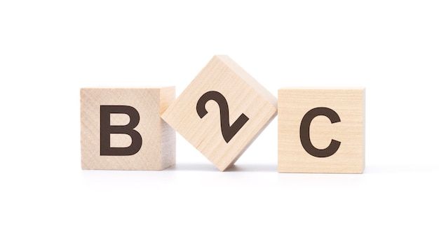 B2c wooden blocks with letters top view on white background