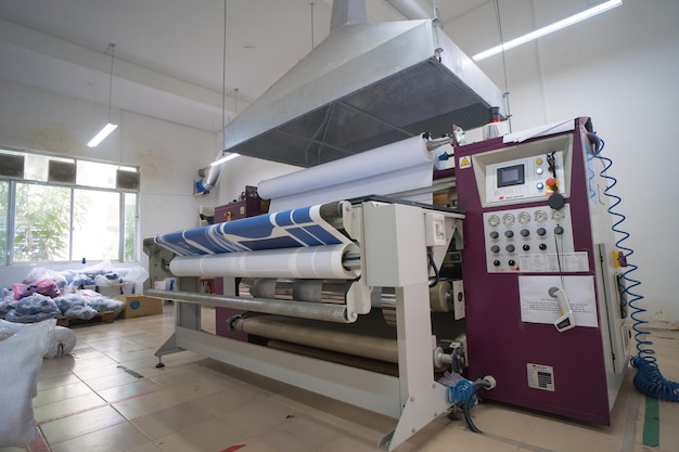 Ba Ria VIETNAM OCT 20 2022 Interior factory Large heat press machine for fabric business in printing room with Ventilation system The concept of industrial equipment and technologies