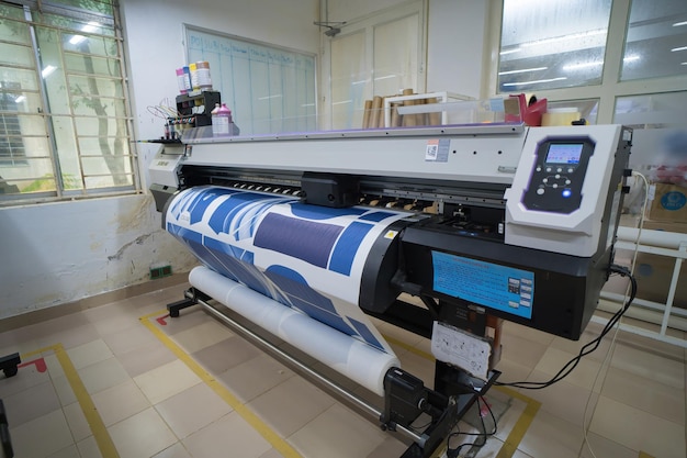 Ba Ria VIETNAM OCT 20 2022 Interior factory Large printing machine for paper business in printing room Sublimation concept